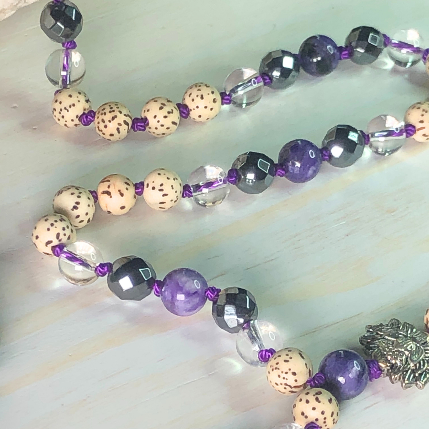 Charoite, Hematite, Clear Quartz, Lotus Seed Mala with Lotus Charm