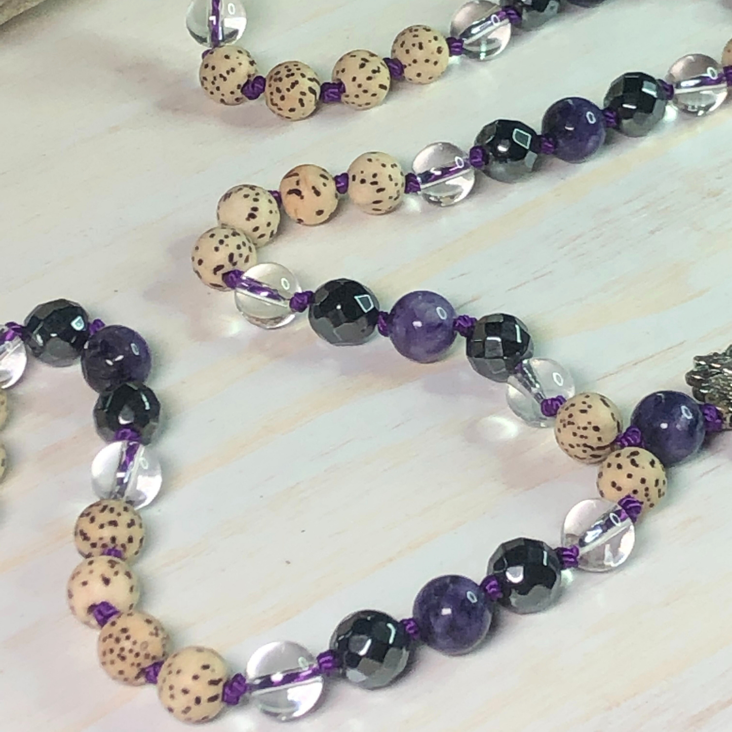 Charoite, Hematite, Clear Quartz, Lotus Seed Mala with Lotus Charm