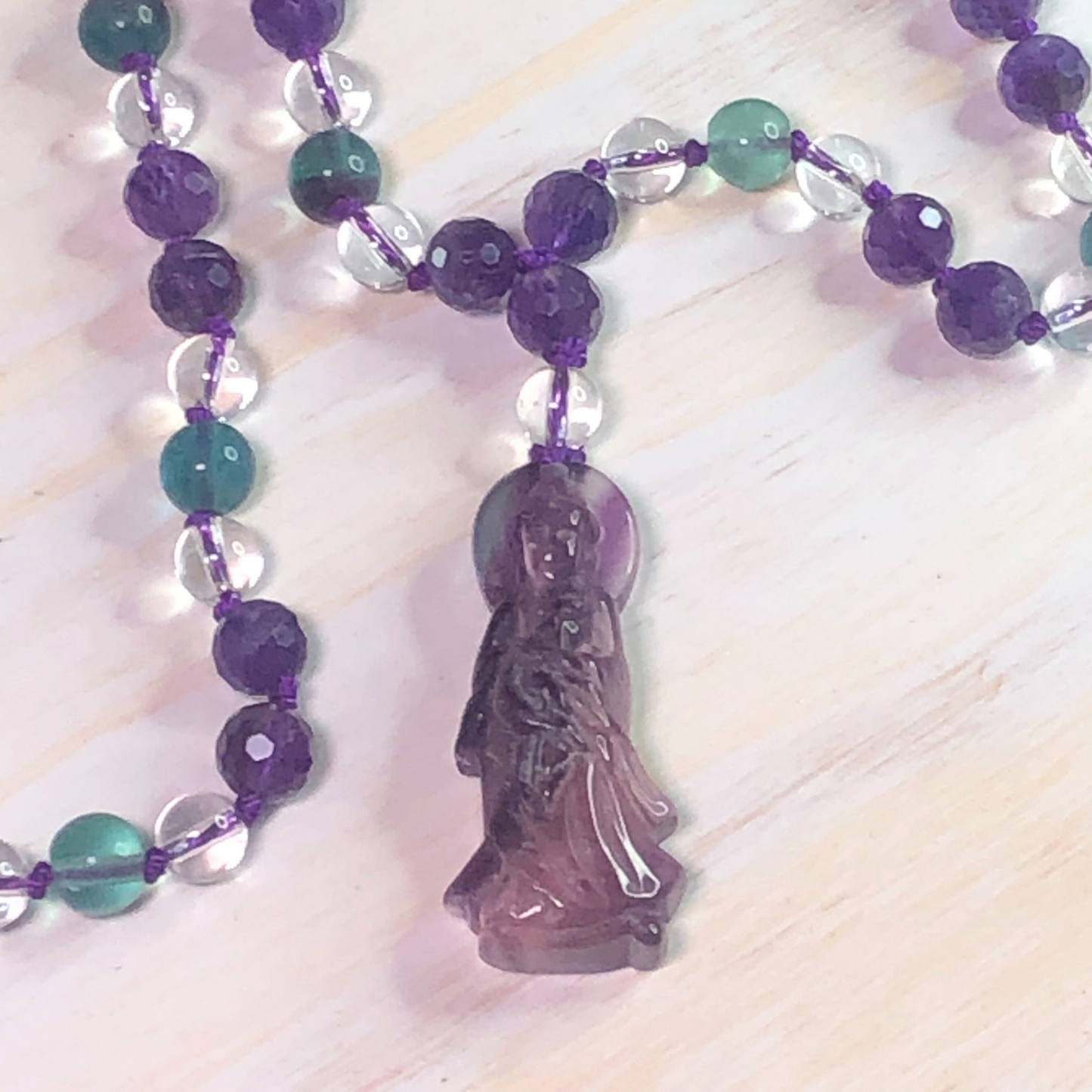 Amethyst, Rainbow Fluorite, and Clear Quartz Mala with Quan Yin Charm