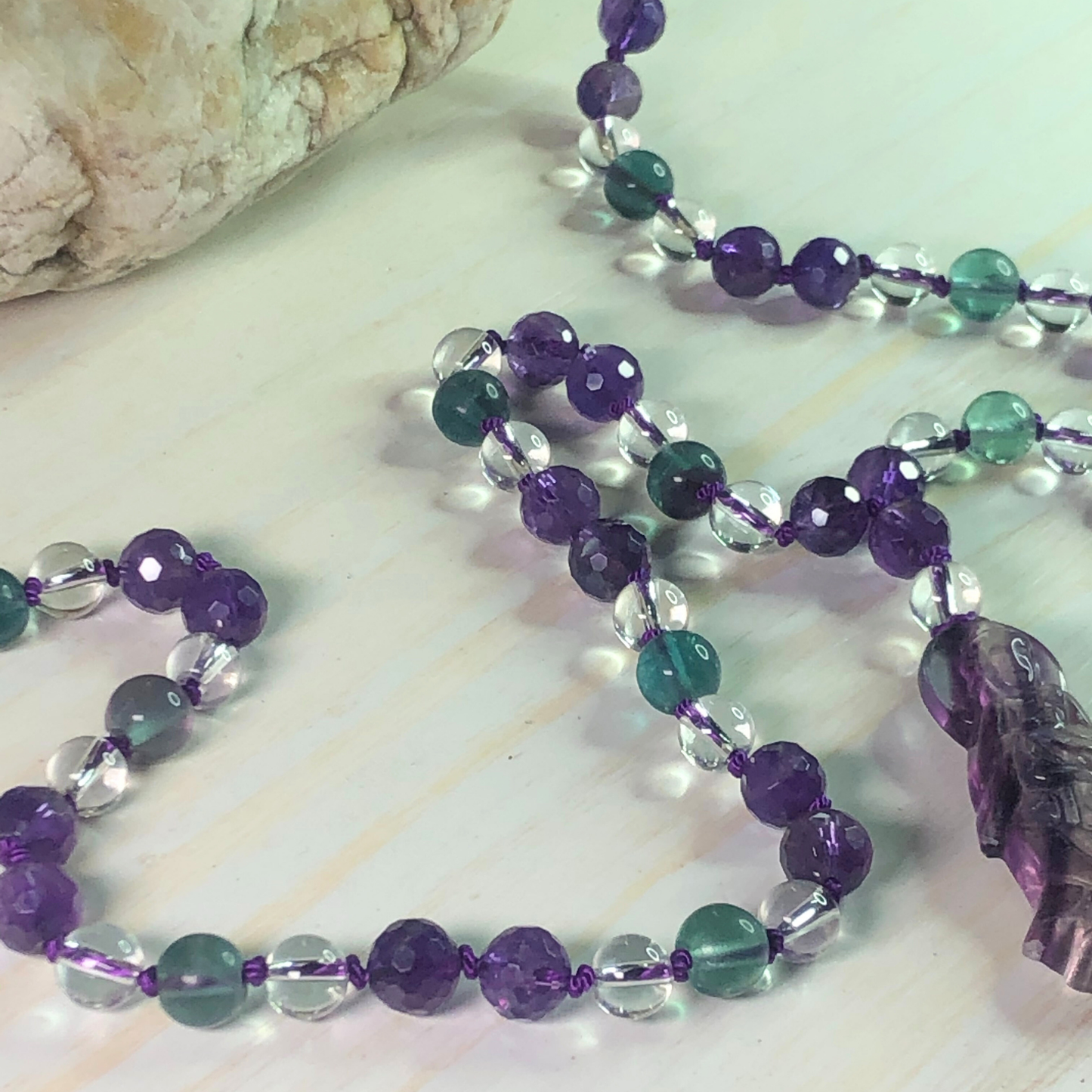 Amethyst, Rainbow Fluorite, and Clear Quartz Mala with Quan Yin Charm
